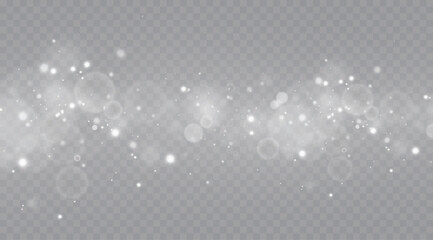 Particles of white magic dust. Shining light particles.Christmas glitter particles. Light effect on a transparent background.