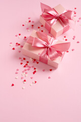 Candy pink confetti with gift box on pink background