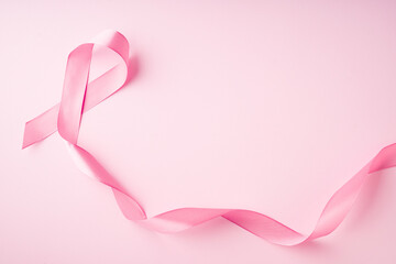 World breast cancer day concept with pink ribbon on pink background - obrazy, fototapety, plakaty
