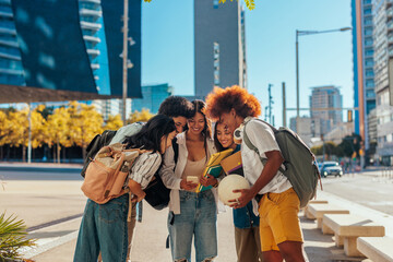 University students using smartphone in city.