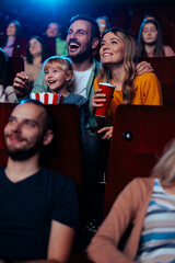 Happy family at movies.
