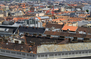 Rooftop view from the tower of St. Stephen's Basilica. Buildings, towers, and colorful rooftops. European capital city skyline. Historical downtown neighborhood houses, Hungarian urban landscape.