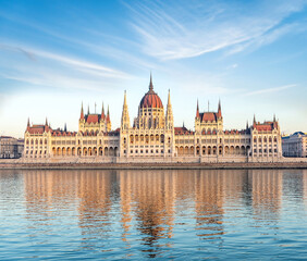 Fototapeta na wymiar Hungarian Parliament Building with reflection in Danube river at sunset, Budapest, Hungary
