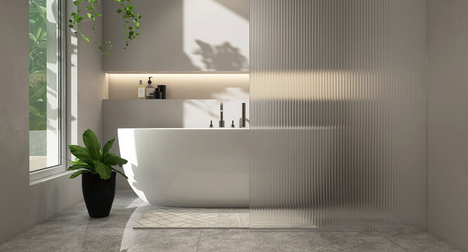 White oval bathtub, chrome shower head in modern loft gray wall bathroom, reeded glass partition with recessed wall shelf, hidden light and plant on marble floor in sunlight for interior background 3D