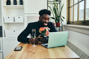 man dating online with flower bouquet and champagne glass - obrazy, fototapety, plakaty