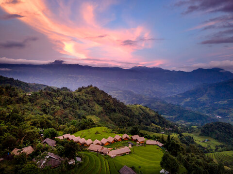 Enjoy a panoramic view of wooden bungalows from above with breathtaking views of the mountains and terraced fields where you can can relax and be in har at resort Hoang Su Phi Lodge, Vietnam