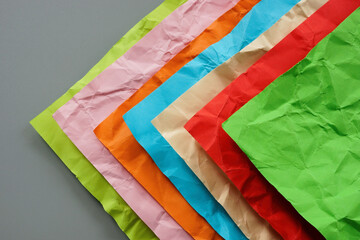 Multi-colored crumpled sheets of paper as a concept of diversity.