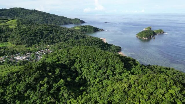 Aerial Pan of hilly tropical coastline and islands, Catanduanes, Philippines