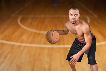 Naklejka premium Young Basketball male Player Bouncing Balls