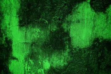 Obraz premium A textured green grunge background with dark patches and rough surface