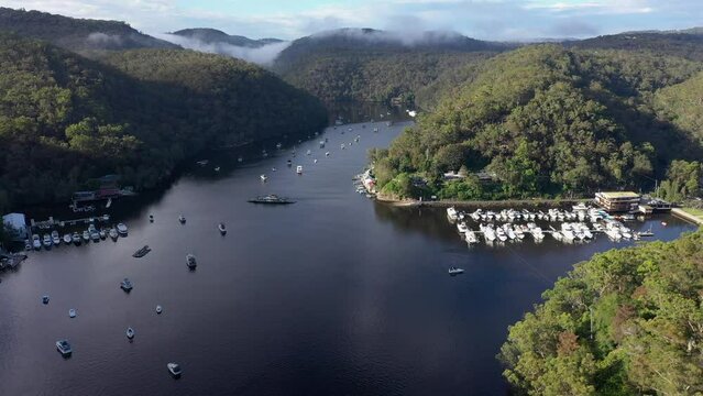 Aerial view of ferry, boats and marina at Berowra Waters, NSW, Australia.