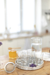 Making a refreshing summer drink. Preparing lemonade in the kitchen. Healthy food concept