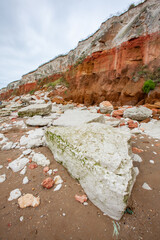 Coastal erosion, East Anglia, UK. Visual evidence of natural environmental erosion on the chalk and sandstone cliffs of the eastern UK coastline. - 580611895