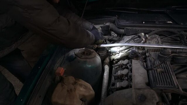 a mechanic disassembles a car to install a turbo engine tuning drift auto