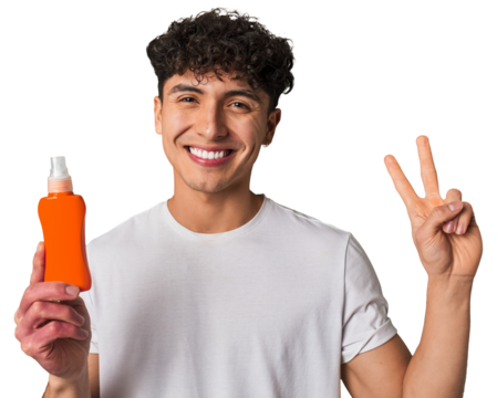 A young latin man holding a solar protection cream showing number two with fingers.