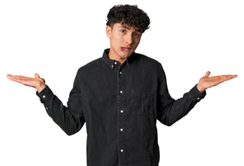 Young latin man feeling energetic and comfortable, rubbing hands confident.