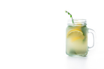 Lemonade drink in a jar glass isolated on white background. Copy space