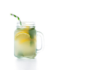 Lemonade drink in a jar glass isolated on white background. Copy space