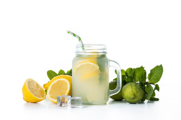 Lemonade drink in a jar glass and ingredients isolated on white background