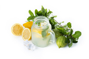 Lemonade drink in a jar glass and ingredients isolated on white background