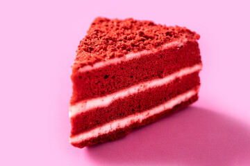 Traditional velvet cake portion on pink background