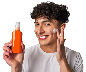 A young man protects his skin from harmful UV rays, applying non-greasy, broad-spectrum sunscreen...