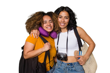 Two diverse friends on a beach vacation with vintage camera, beach bag, and travel pillow happy,...