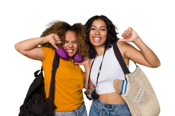 Two diverse friends on a beach vacation with vintage camera, beach bag, and travel pillow feels proud and self confident, example to follow.