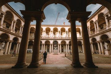 Fototapeta premium Brera Art Gallery (Pinacoteca di Brera) courtyard with people