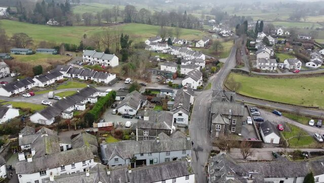 Cinematic aerial drone footage of Hawkshead Village and St Michael and All Angels Church.Cumbria UK.
