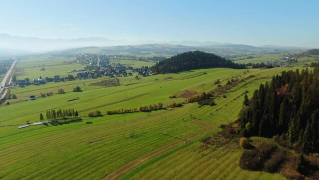 Aerial panorama of scenic pastures by Zakopianka highway, Poland
