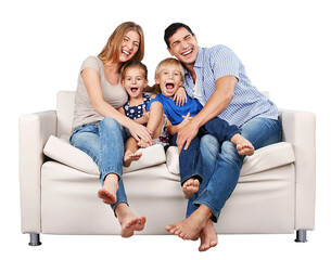 Beautiful smiling family sitting at sofa at home