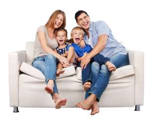 Beautiful smiling family sitting at sofa at home