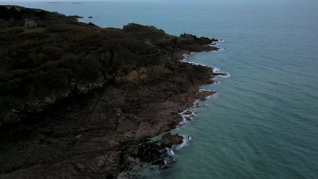 Building of Daules guardhouse between Plage du Verger and Petit Port beach, Cancale in France. Aerial drone view