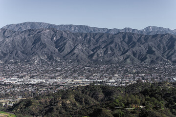 The stunning contrast between the towering mountains and the sprawling city of Los Angeles