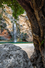 cueva turche a fascinating waterfall with a lagoon-like small lake in spain portrait format