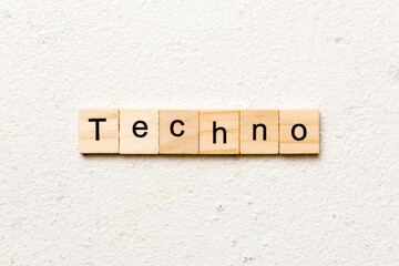 techno word written on wood block. techno text on table, concept