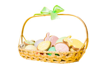 Fototapeta na wymiar Colorful easter cookies in basket with Multi colors Easter eggs isolated on white background. Pastel color Easter eggs. holiday concept