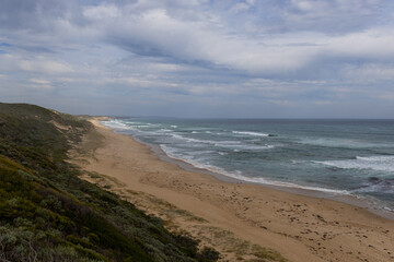 Cloudy day on the empty beach coastline.