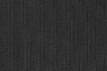 Fototapeta na wymiar Black woolen fabric texture with vertical stripes, close up background