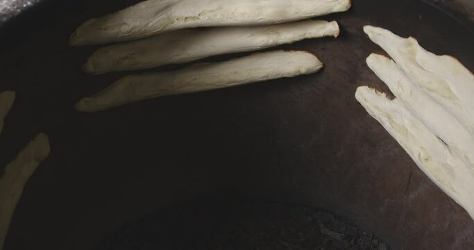 Shotis Puri Bread In A Georgian Clay Torne Oven. High Angle