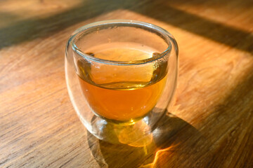 Glass cup of Hot herbal tea after pampering time self care. Mindfulness living lifestyle.