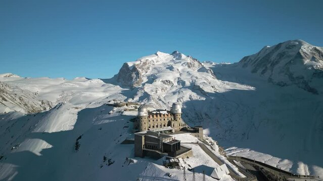 Drone Circles Above Alpine Mountain Lookout, Gornergrat. Winter