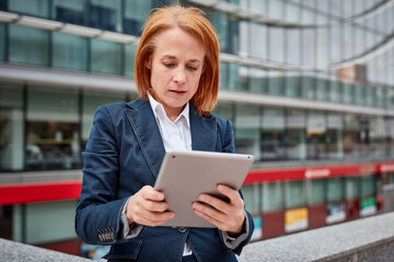 Fototapeta premium A tech-savvy businesswoman! Her digital skills and innovation drive progress while surrounded by the corporate world.