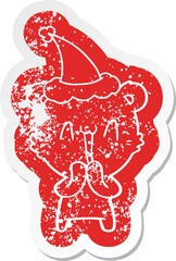 happy bear cartoon distressed sticker of a wearing santa hat