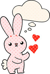 cute cartoon rabbit with love hearts and thought bubble in comic book style