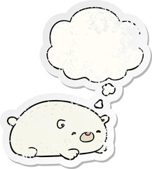 cartoon polar bear and thought bubble as a distressed worn sticker