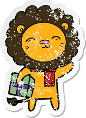 distressed sticker of a cartoon lion with christmas present