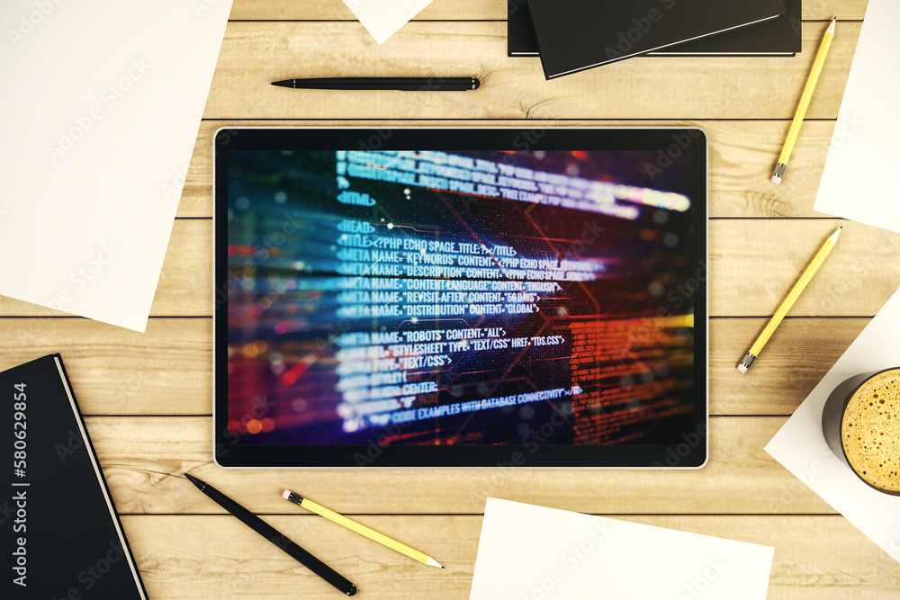 Fototapete Modern digital tablet monitor with abstract programming language, research and development concept. Top view. 3D Rendering