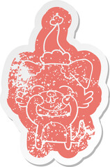 cartoon distressed sticker of a dog wearing santa hat